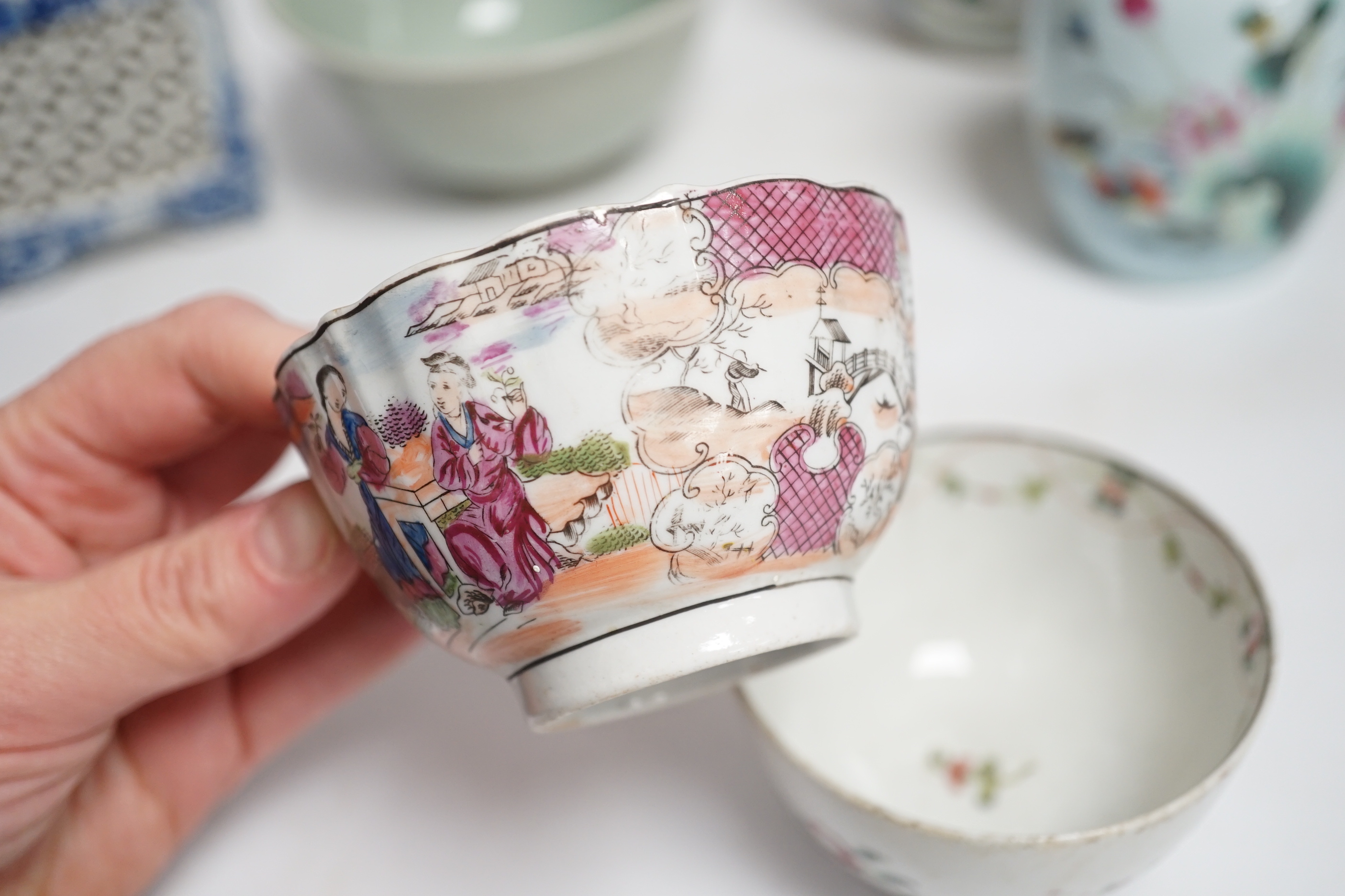 A collection of Chinese ceramics including celadon bowl decorated in low relief with fish, famille rose tea bowls and a jar, largest 12cm high